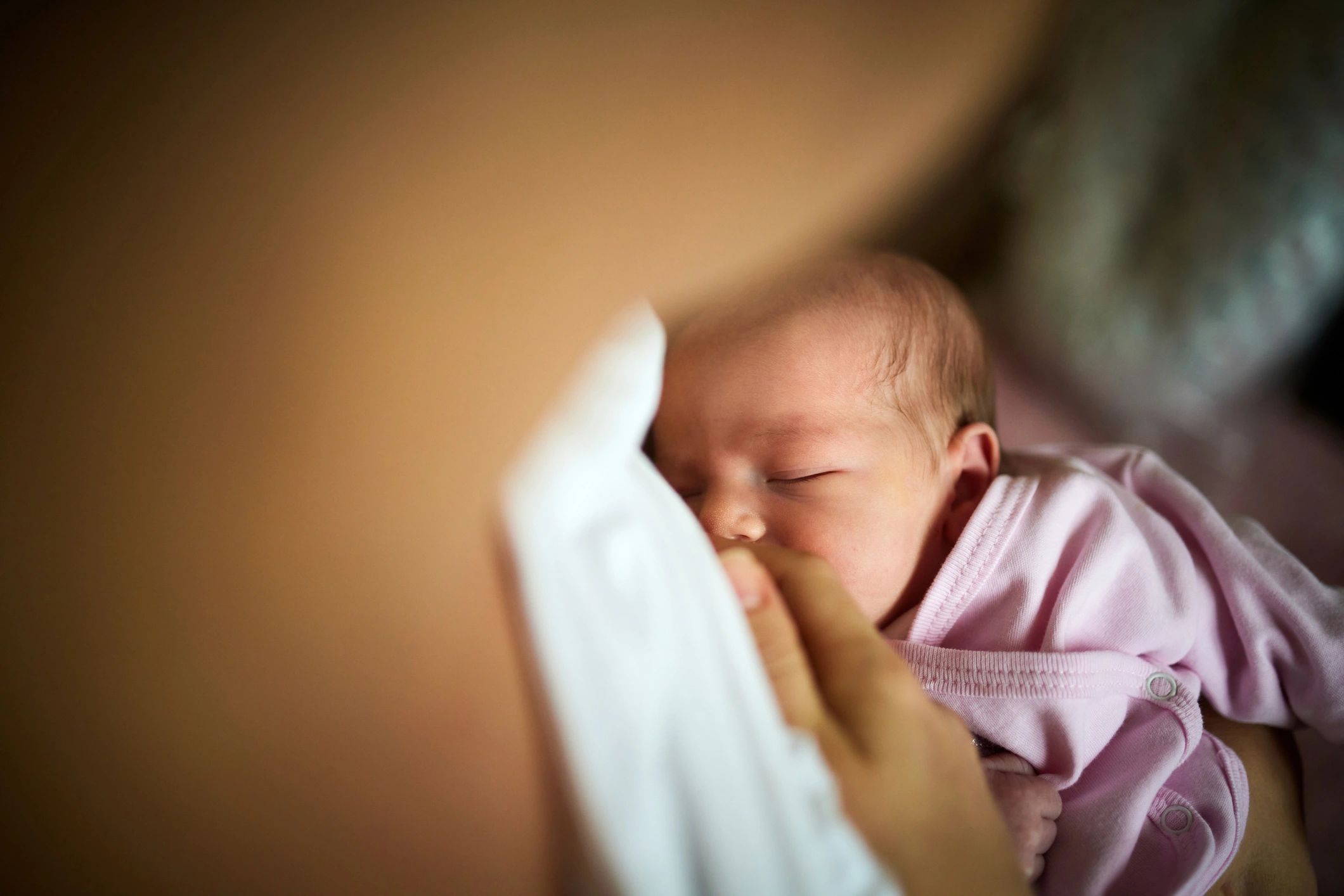 Newborn breastfeeding peacefully